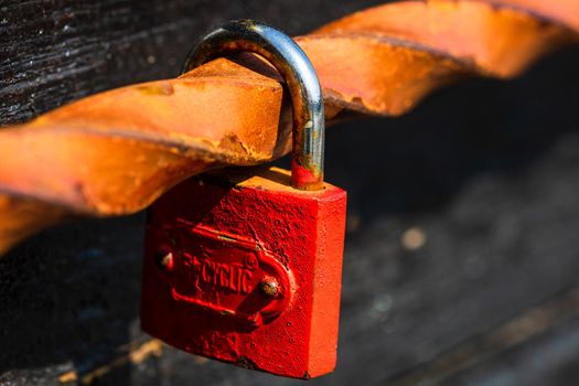 Love symbol, old rusty padlocks hanging on wooden fortress bridge in Alba Iulia, Romania, 2021