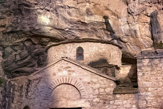 Orthodox monastery enclosed by Davelis cave in Penteli, a mountain to the north of Athens, Greece.