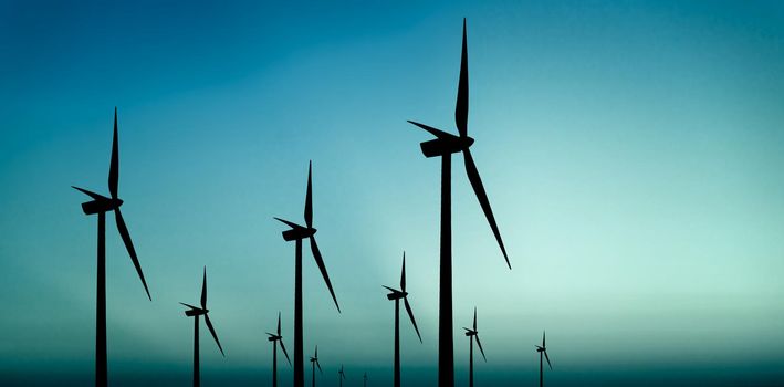 Wind turbines silhouette on blue background