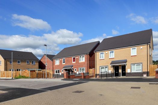 New and modern english houses on blue sky