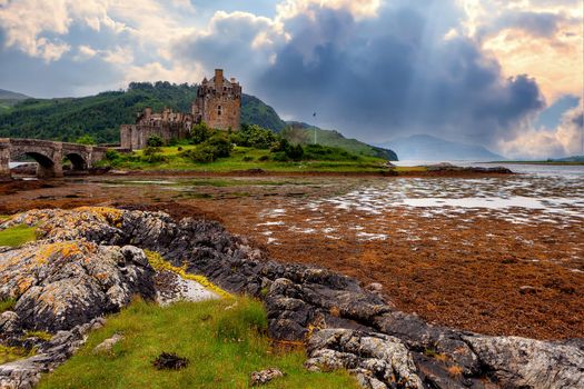 Beautiful lake and castle on the hill at sunset