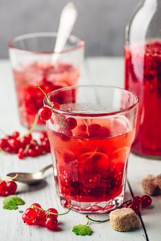 Infused water with fresh red currant and cane sugar