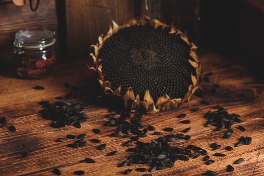 Dried sunflower and roasted seeds on the old wooden table