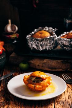 Baked Pattypan squash stuffed with ground beef on white plate