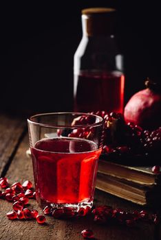 Pomegranate infusion in tumbler with fresh fruit