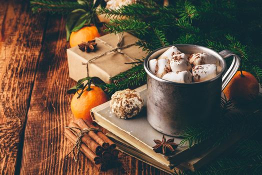 Mug of hot chocolate with marshmallows over wooden table