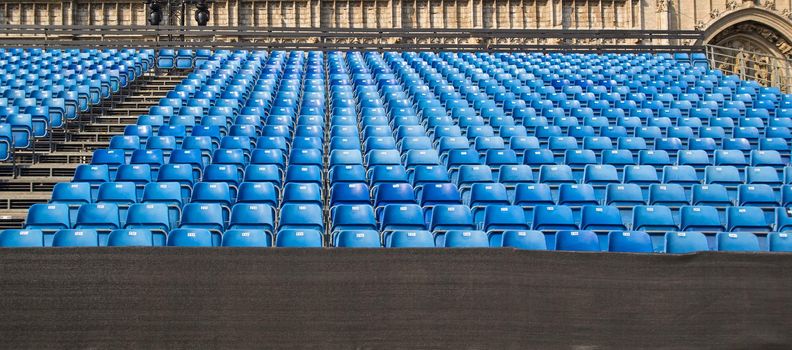 Empty rows of chairs, seats in the concert hall, in the sports hall.