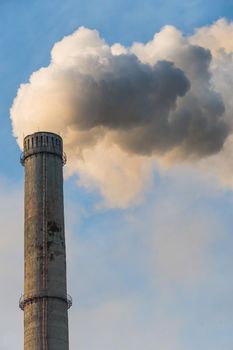 Smoking factory chimneys with co2 emissions.Environmental problem of environmental and air pollution.Climate change,ecology, global warming.The sky is smoky with toxic substances.Soot from factories