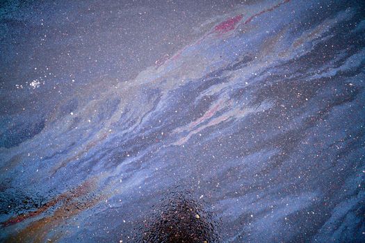 Gasoline stain on Asphalt, color Oil fuel spots on Asphalt Road as Texture or Background