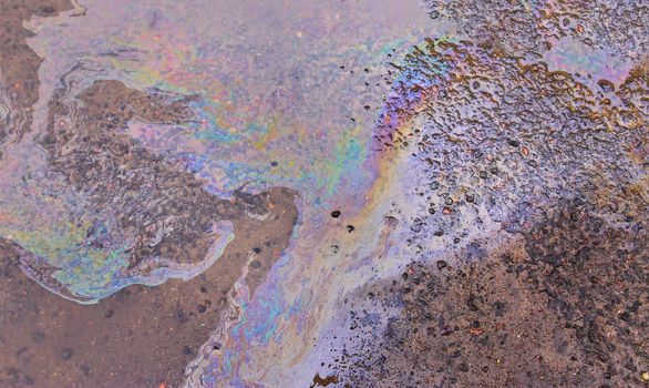 Gasoline stain on Asphalt, color Oil fuel spots on Asphalt Road as Texture or Background