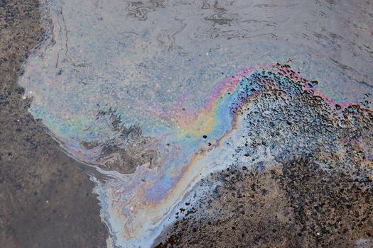 Gasoline stain on Asphalt, color Oil fuel spots on Asphalt Road as Texture or Background