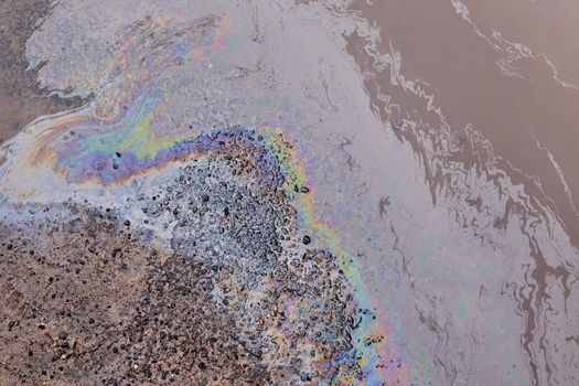 Gasoline stain on Asphalt, color Oil fuel spots on Asphalt Road as Texture or Background