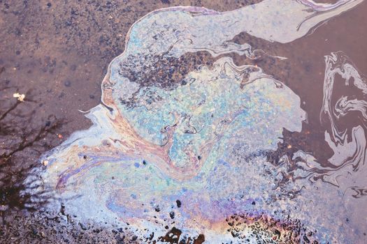 Oil stain on Asphalt, color Gasoline fuel spots on Asphalt Road as Texture or Background