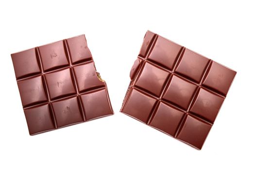 Two chocolate bars on white background. Closeup.