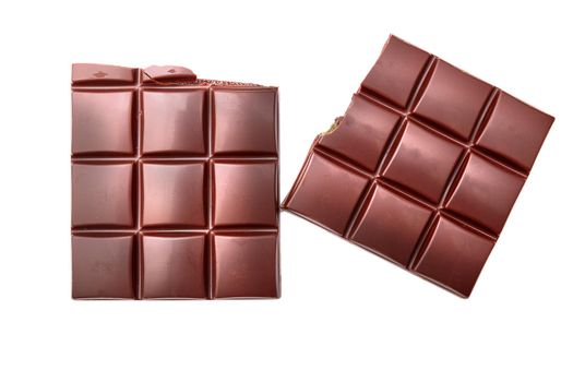 Dark chocolate bar and cubes isolated on white backgroun, top view