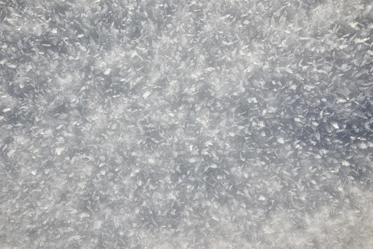 Snow texture background, natural white snow powder in winter on a bright sunny day
