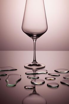 Empty wine glasses on a clean gradient background. Empty drinking transparent wine glasses