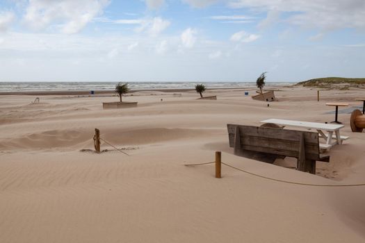 Sand covered restaurant . The beach in Hargen aan Zee in Netherlands without foreign tourists after the coronavirus pandemic.