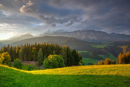 Dachstein mountain and summer valley views from Almwelt Austria resort.  Almwelt Austria is located 7 km from the city Schladming. The nicely furnished rooms are set in chalets.