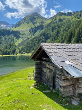Very old barn, Duisitzkarsee Lake in Austria.The Duisitzkarsee is probably one of the most beautiful mountain lakes in the Schladminger Tauern.The place without  tourists after the coronavirus pandemic.