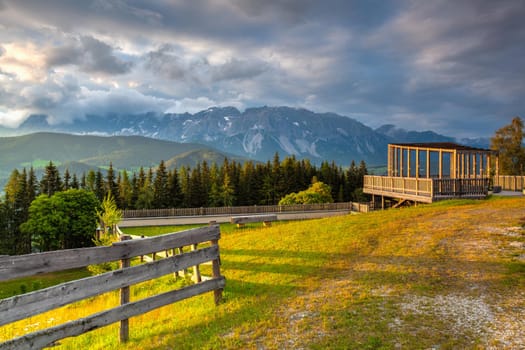 Dachstein mountain and summer valley views from Almwelt Austria resort.  Almwelt Austria is located 7 km from the city Schladming. The nicely furnished rooms are set in chalets.