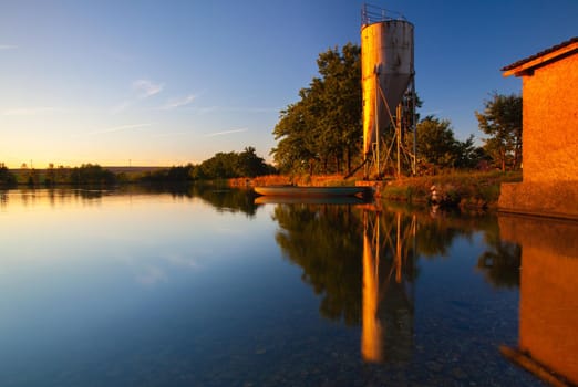 Farm for breeding fish. Evening on the breeding pond. Czech Republic