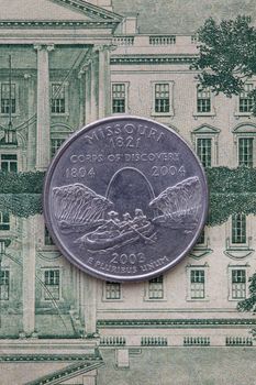 A quarter of Missouri on US dollar bills. Symmetric composition of US dollar bills and a quarter of Missouri