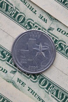 A quarter of Texas on US dollar bills. Symmetric composition of US dollar bills and a quarter of Texas.