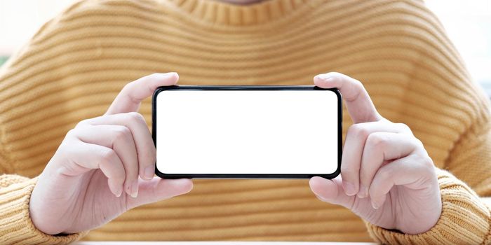 hand holding phone mobile and touching screen isolated on white background, mock-up smartphone matte black color.