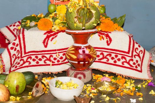 Mangal Ghat or Mangal Kalas Kolsi With coconut, Flowers used in Worship of Hindu God. Image taken in Vasant Panchami or Sarasvati Puja festival celebration. Kolkata West Bengal India 16 February 2021