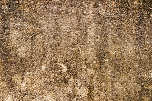 Close up Sand Wall Texture Pattern Background design element. Sandy effects on sandstone plaster pillar with minor cracks and uneven patches and highlighting Natural brown color shade. Copy Space