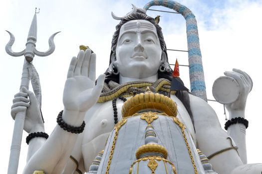 Lord Shiva Statue. Masterpiece Marble sculpture Meditating Shiva Statue. Large Majestic. Low angle view.