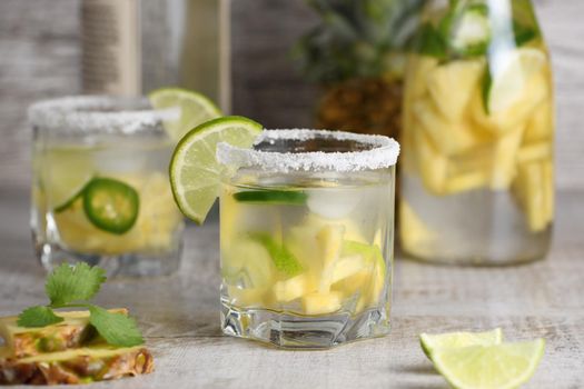 Spicy Margarita. Tequila Infused on Slices of Fresh Pineapple, Lime,  hot jalapeno