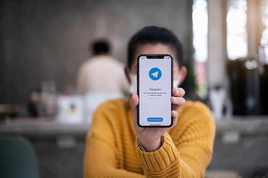 CHIANG MAI, THAILAND APR 14 2021 : Telegram application icon on Apple iPhone screen. Telegram is an online social media network. Social media app and Telegram app icon