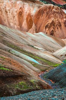 Unearthly patterns, curvy lines and magic colors. Iconic colorful rainbow volcanic mount in Landmannalaugar mountain region in Iceland as a background for design