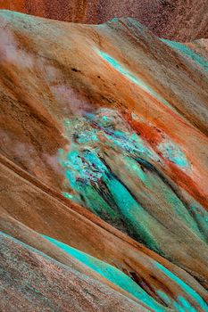 Unearthly patterns, curvy lines and magic colors. Iconic colorful rainbow volcanic mount in Landmannalaugar mountain region in Iceland as a background for design