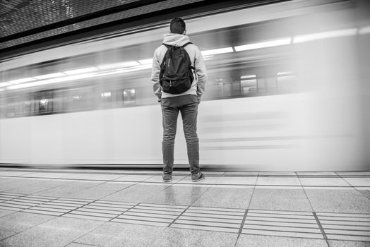 Man with his back turned in the Barcelona metro in times of COVID19.