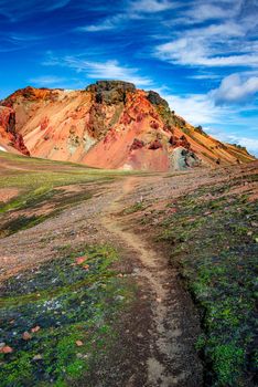 Hiking trail to the recently erupted volcano in colorful rainbow volcanic Landmannalaugar mountains, near famous Laugavegur hiking trail, in Iceland, summer