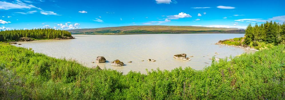 Panoramic view over huge Lagarfjot lake in Iceland at sunny day and blue sky