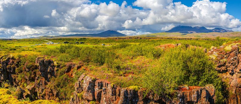 Panoramic view over beautiful summer landscape with deep earth cracks at the Thingvallavatn lake in Iceland