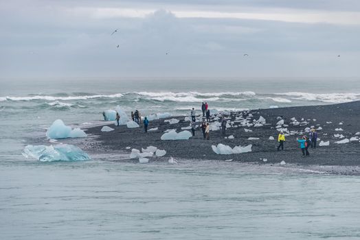 Touristic activity in Glacier Lagoon Jokulsarlon with icebergs in Iceland