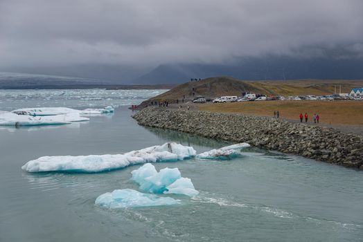 Touristic activity in Glacier Lagoon Jokulsarlon with icebergs in Iceland