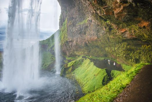 Beautiful, with cave inside Seljalandsfoss waterfall in South Iceland