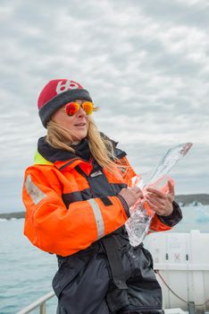 Touristic activity in Glacier Lagoon Jokulsarlon with icebergs in Iceland