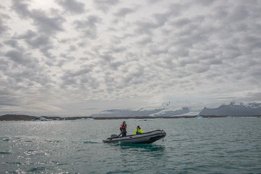 Touristic activity in Glacier Lagoon Jokulsarlon with icebergs in Iceland