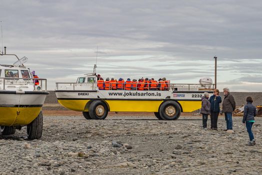 Touristic activity in Glacier Lagoon Jokulsarlon with icebergs in Iceland