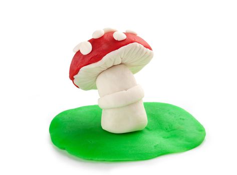 Isoalted plasticine mushrooms on the white background