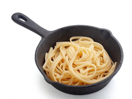 Prepared pasta on the black cast icon pan