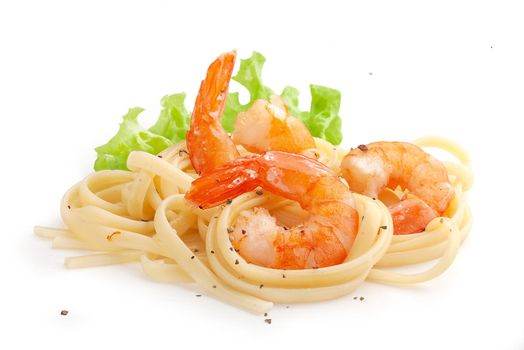 Handful of fried shrimps with pasta and fresh lettuce
