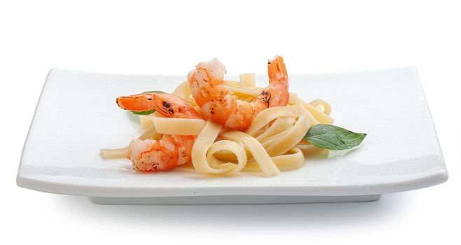 Roasted shrimps with pasta on the plate